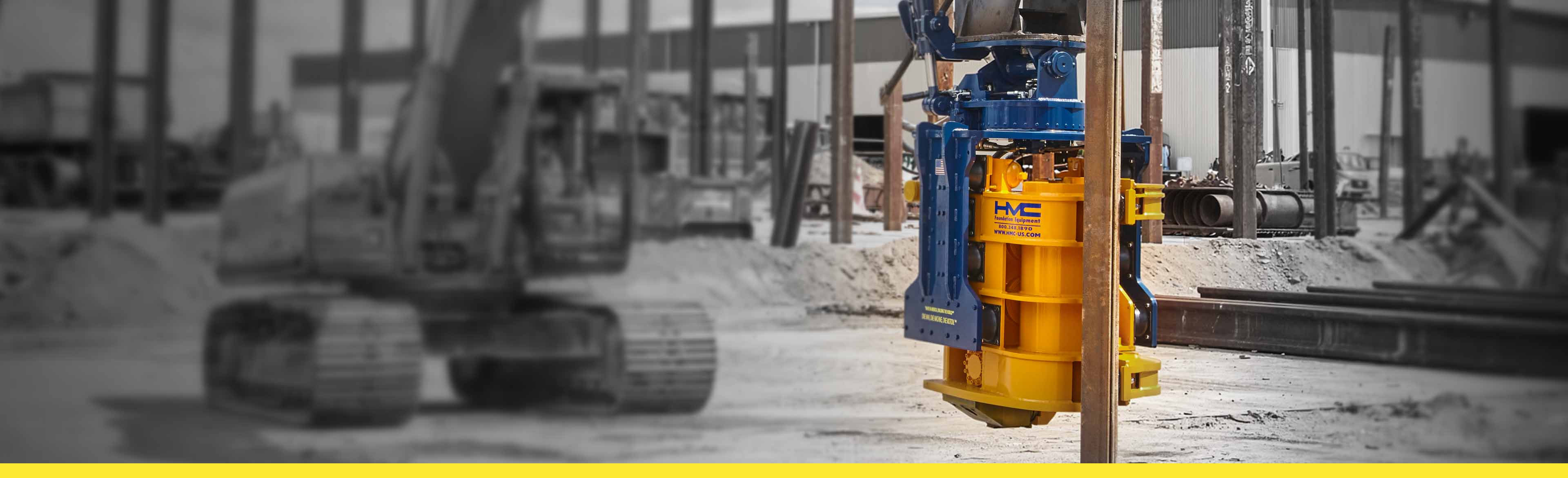 A digger mounted with a Hercules SideGrip pile driver.